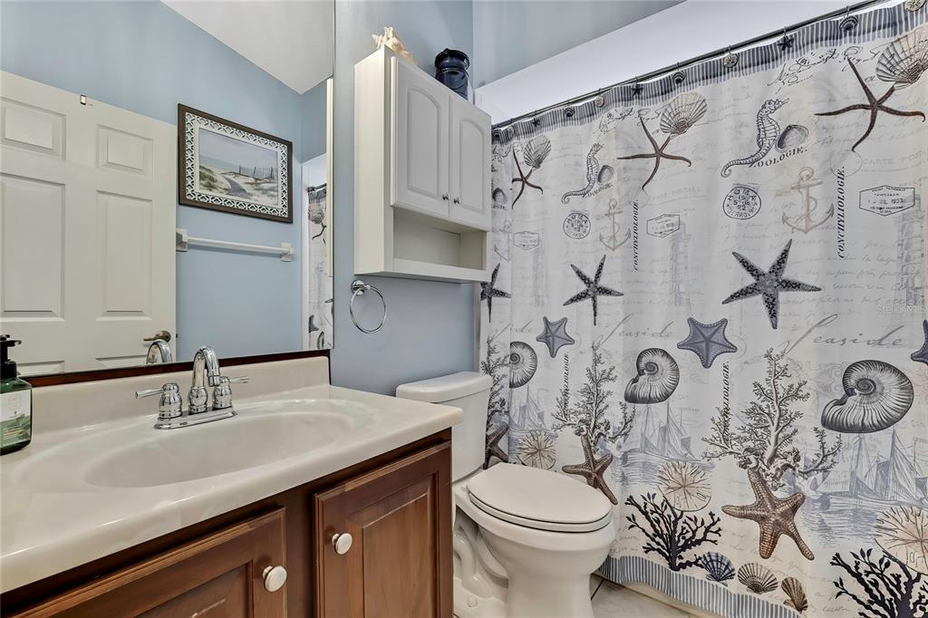 488 Fort Mill Lane Spring Hill, FL 34609 - Photo 25 of 54 a bathroom with a sink and a mirror