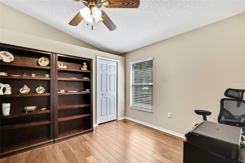 488 Fort Mill Lane Spring Hill, FL 34609 - Photo 27 of 54 a view of wooden floor and windows in a room