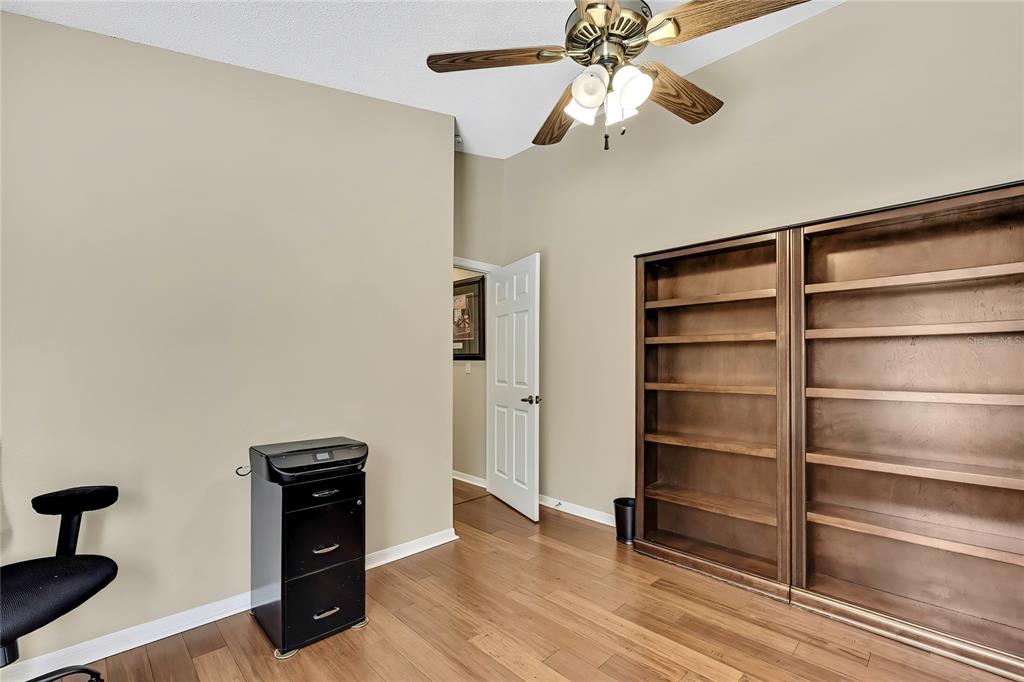 488 Fort Mill Lane Spring Hill, FL 34609 - Photo 28 of 54 a view of walk in closet with empty racks
