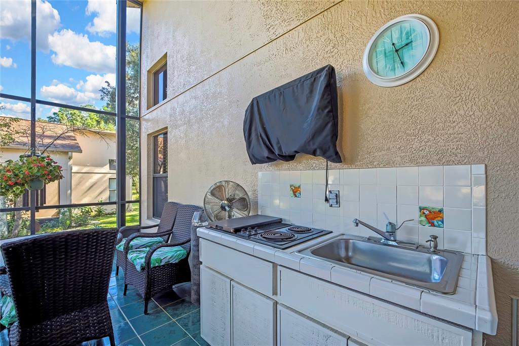 488 Fort Mill Lane Spring Hill, FL 34609 - Photo 30 of 54 a kitchen with a sink and a stove