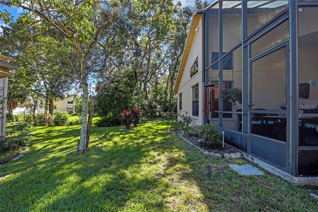 488 Fort Mill Lane Spring Hill, FL 34609 - Photo 34 of 54 a view of a house with a yard