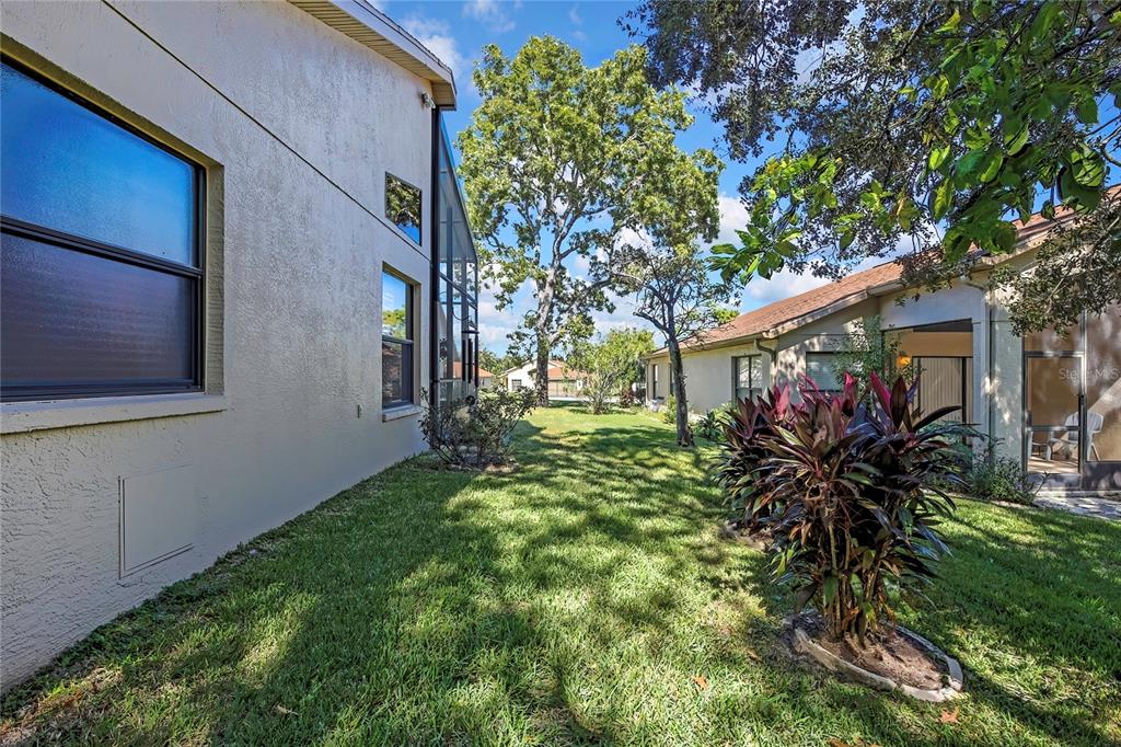 488 Fort Mill Lane Spring Hill, FL 34609 - Photo 35 of 54 a view of a house with a tree in a yard