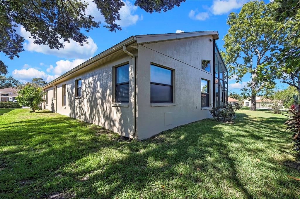 488 Fort Mill Lane Spring Hill, FL 34609 - Photo 36 of 54 a view of a house with a yard