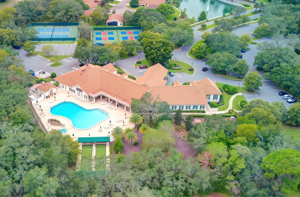 488 Fort Mill Lane Spring Hill, FL 34609 - Photo 38 of 54 a aerial view of a house with swimming pool and outdoor seating