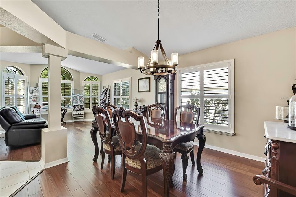 488 Fort Mill Lane Spring Hill, FL 34609 - Photo 8 of 54 a view of a dining room with furniture window and wooden floor