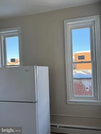 a white refrigerator freezer and a window