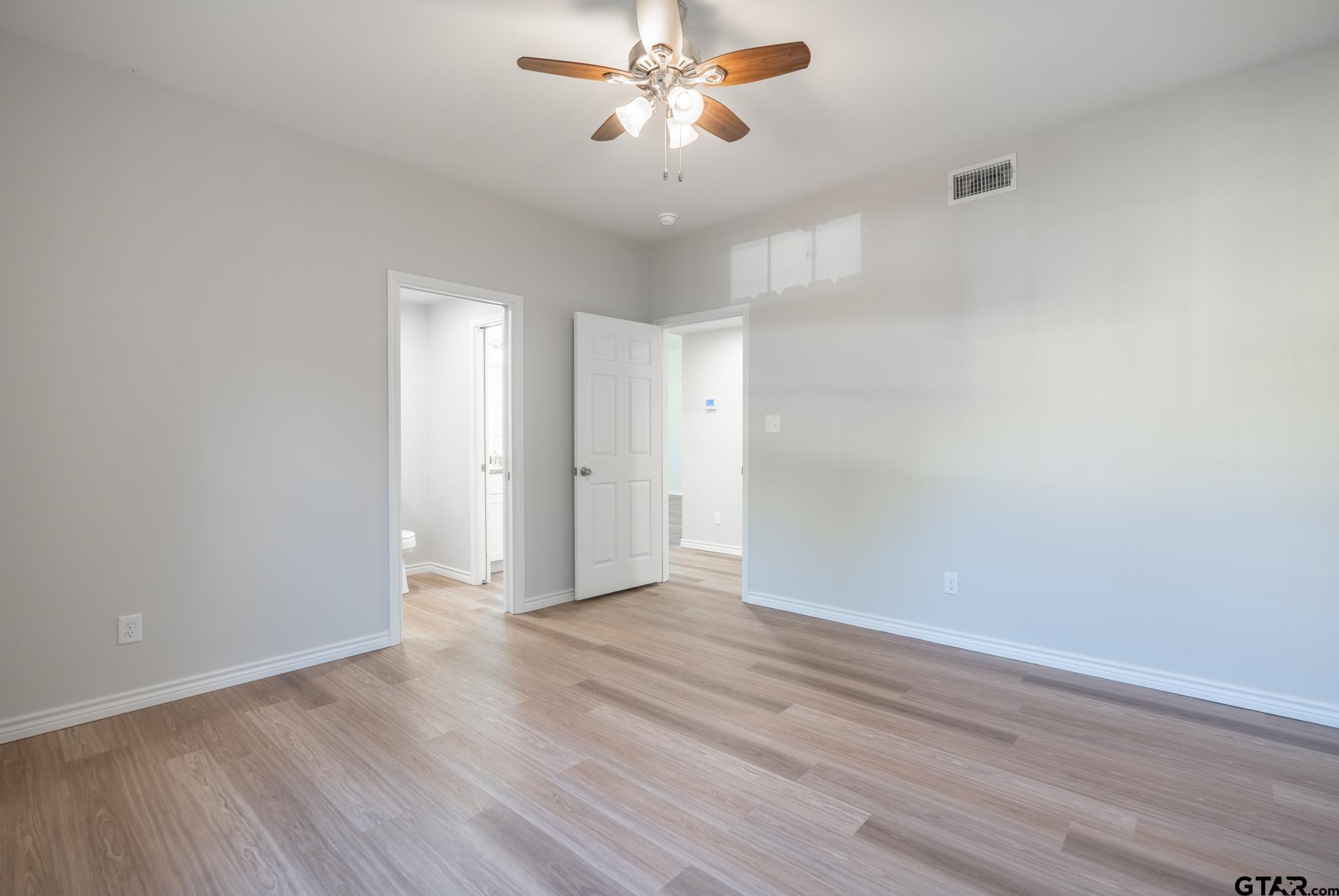 233 Harrison Street Longview, TX 75601 - Photo 21 of 44 wooden floor in an empty room