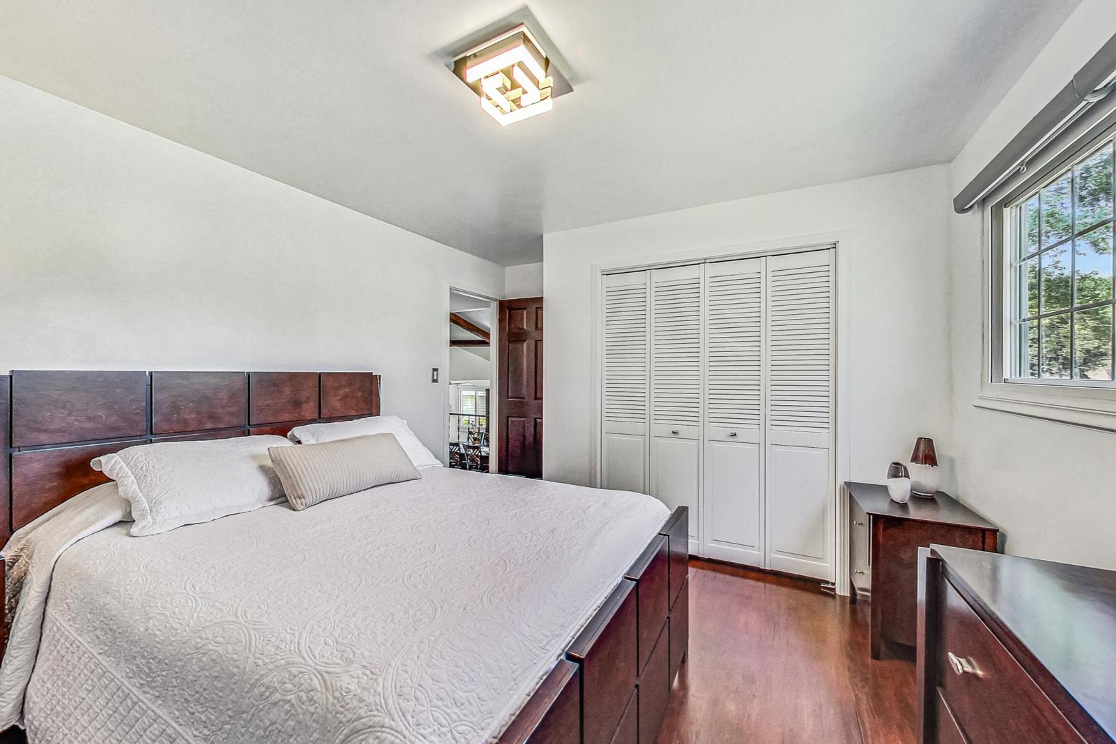 921 Crockett Avenue Addison, IL 60101 - Photo 12 of 34 a bedroom with a bed and a window