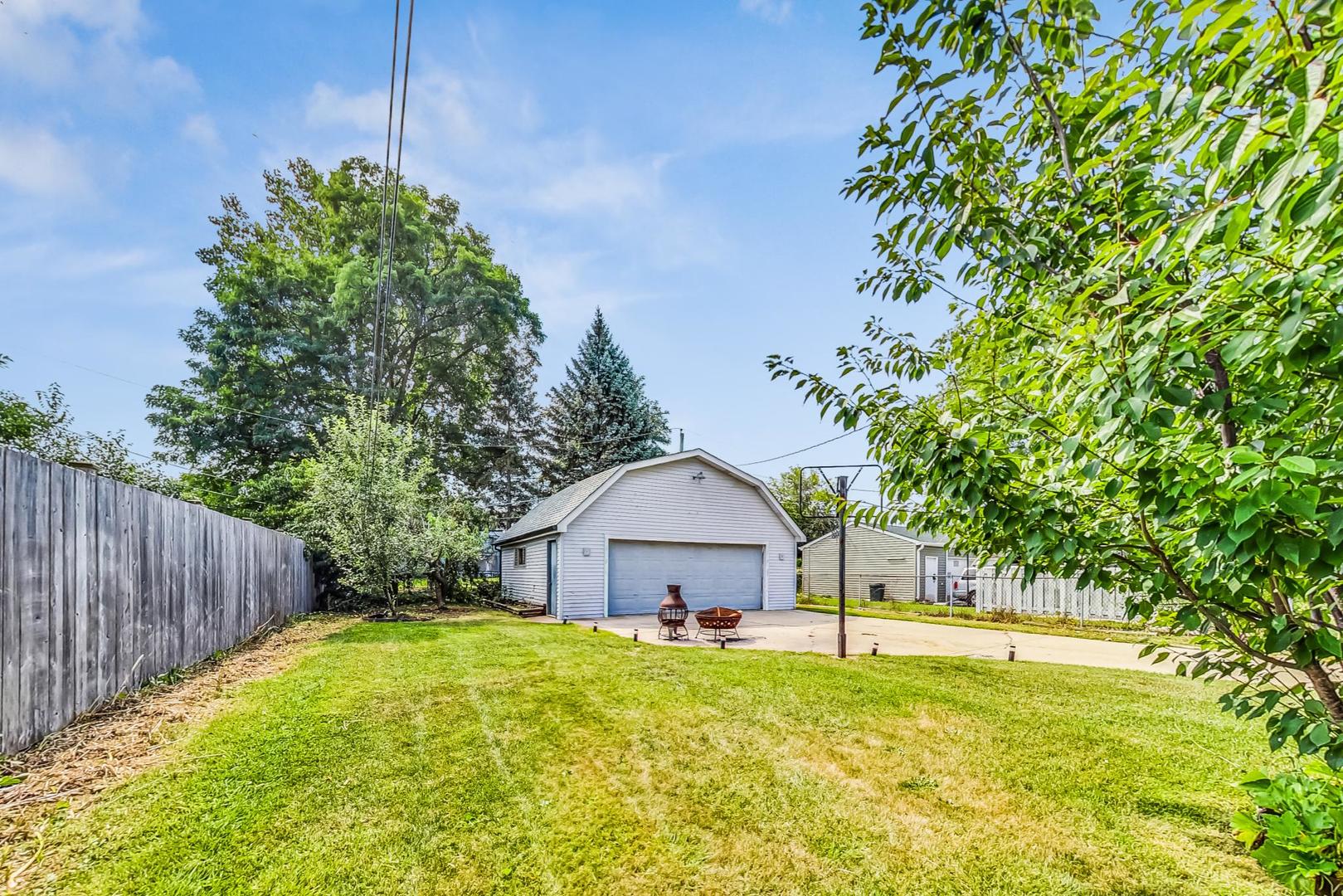 921 Crockett Avenue Addison, IL 60101 - Photo 29 of 34 a house view with a garden space