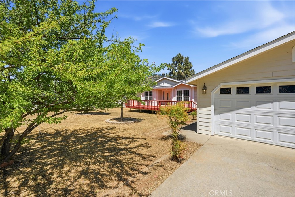 2860 Spring Valley Road Clearlake Oaks, CA 95423 - Photo 3 of 38 a front view of a house with a yard