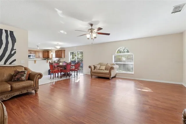 a kitchen with kitchen island granite countertop a stove and a sink