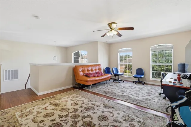 a spacious bedroom with a bed and a window