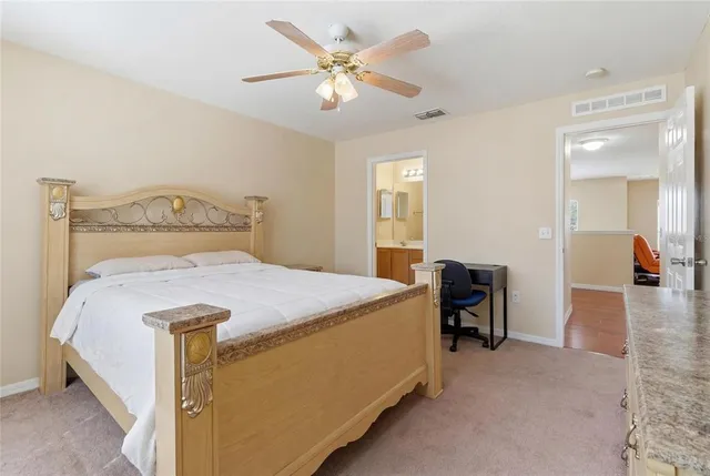 a bedroom with furniture and a chandelier