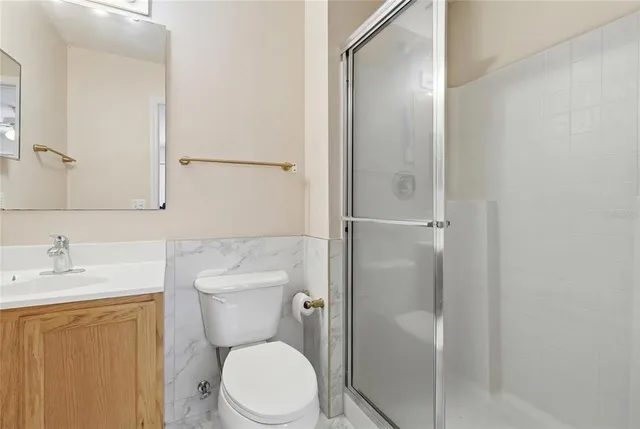 a spacious bedroom with a bed and window