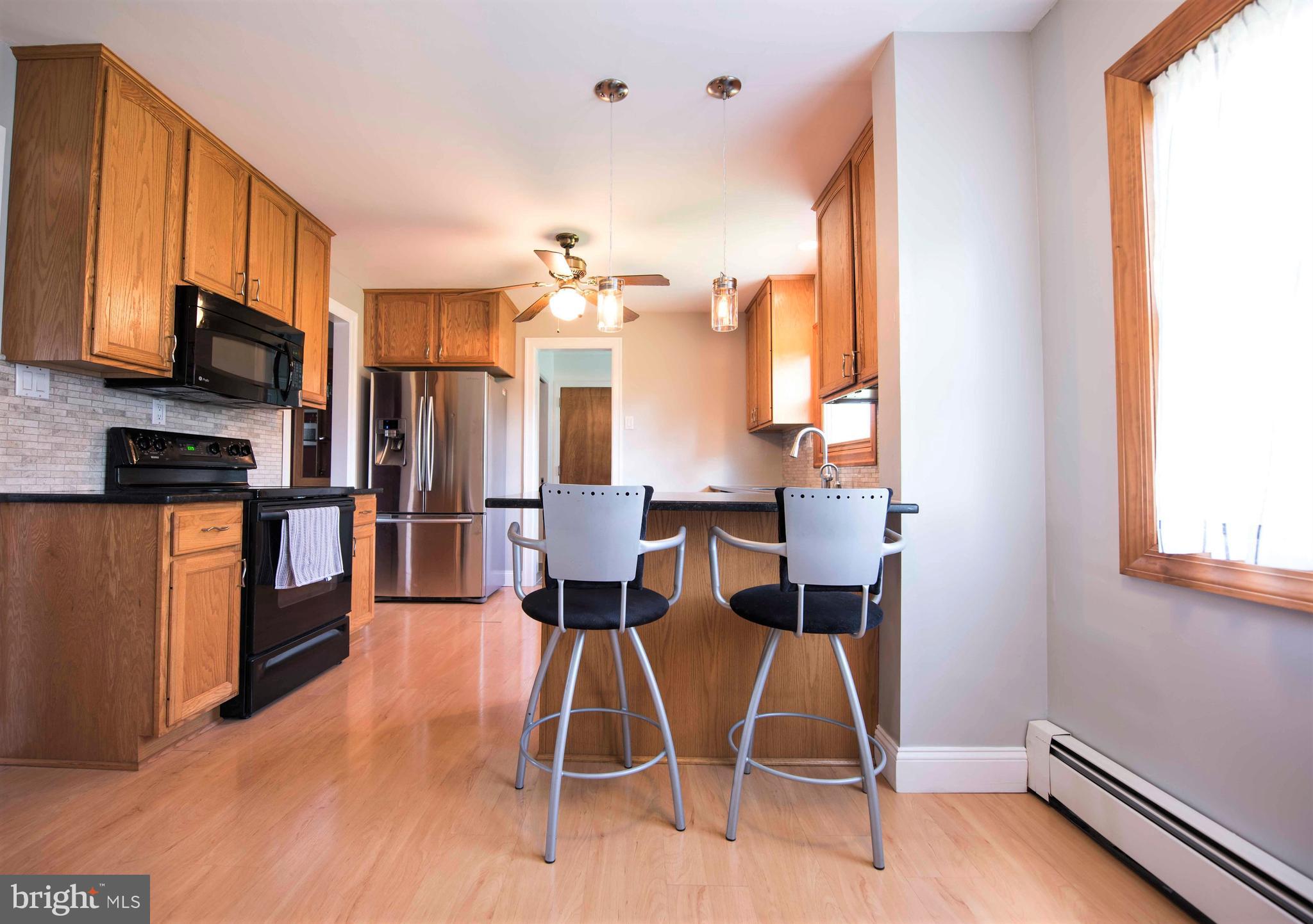 1003 Clymer Road Hatfield, PA 19440 - Photo 7 of 34 Kitchen-42" Oak Cabinetry, Breakfast Bar