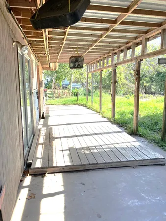 a bed sitting in a bedroom next to a large window