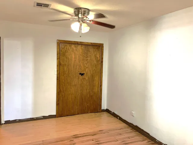 a room with a window and a shower