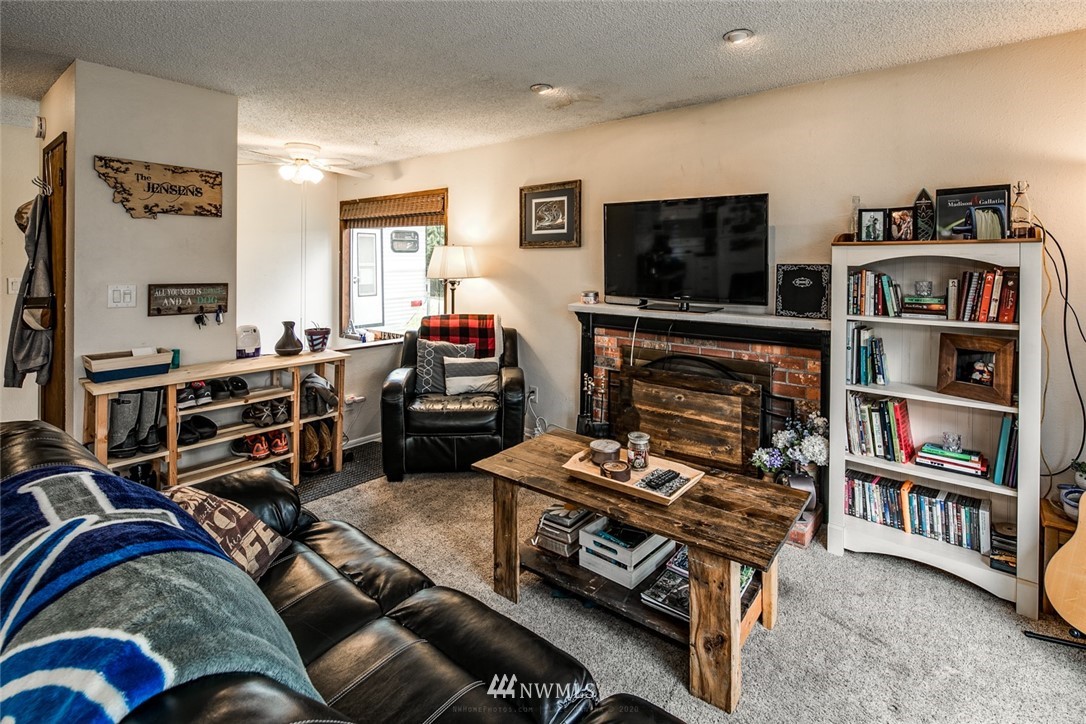 535 Kline Road Bellingham, WA 98226 - Photo 3 of 31 a living room with furniture and a flat screen tv