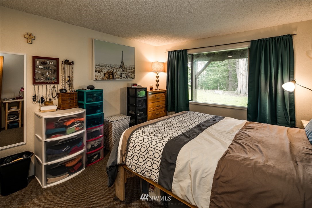 535 Kline Road Bellingham, WA 98226 - Photo 8 of 31 a bedroom with a bed and a dresser
