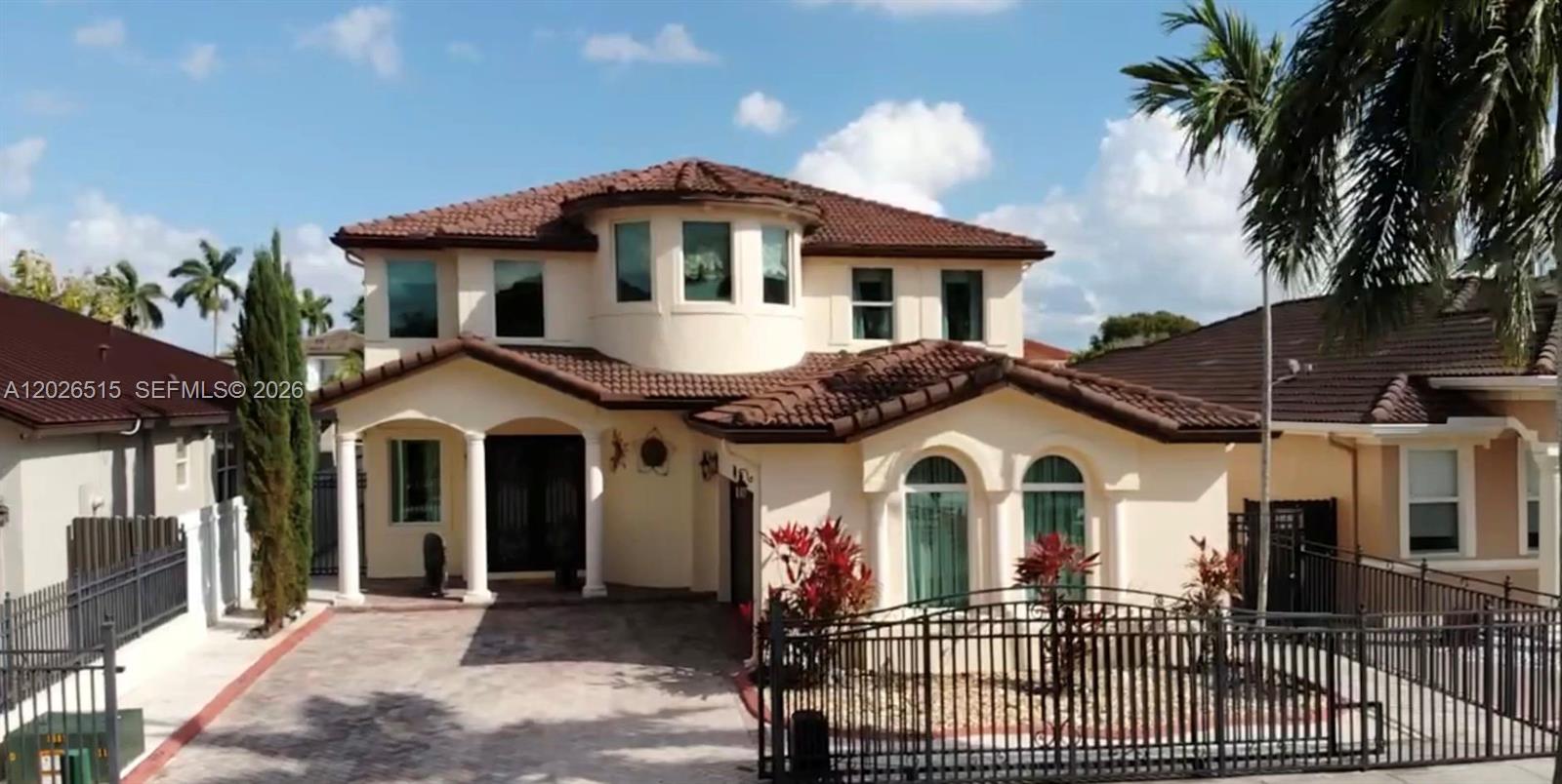 1065 Southwest 150th Place Miami, FL 33194 - Photo 1 of 14 a front view of a house with a porch