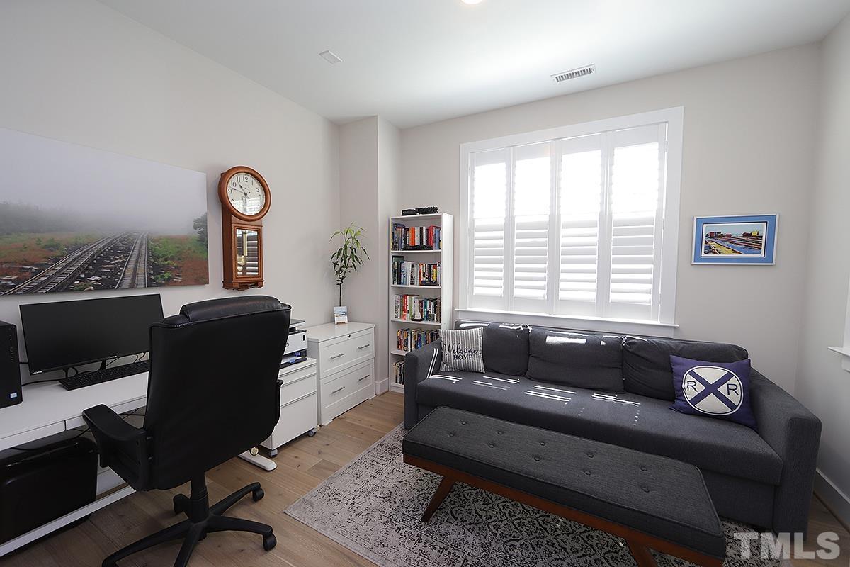 1611 Draper View Loop, Unit 101 Raleigh, NC 27608 - Photo 11 of 13 a living room with furniture