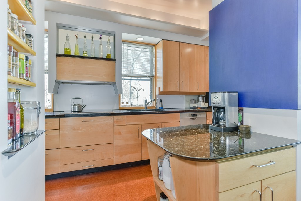 188 Rawson Road, Unit B Brookline, MA 02445 - Photo 11 of 21 a kitchen with granite countertop a sink and a stove