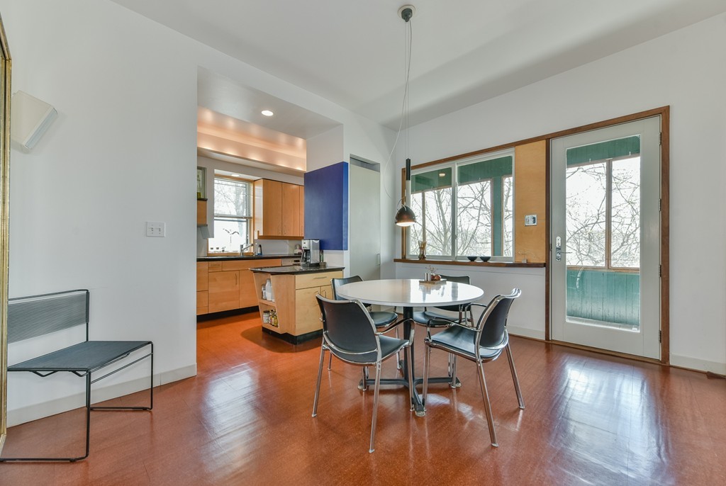 188 Rawson Road, Unit B Brookline, MA 02445 - Photo 12 of 21 a view of a dining room with furniture window and wooden floor