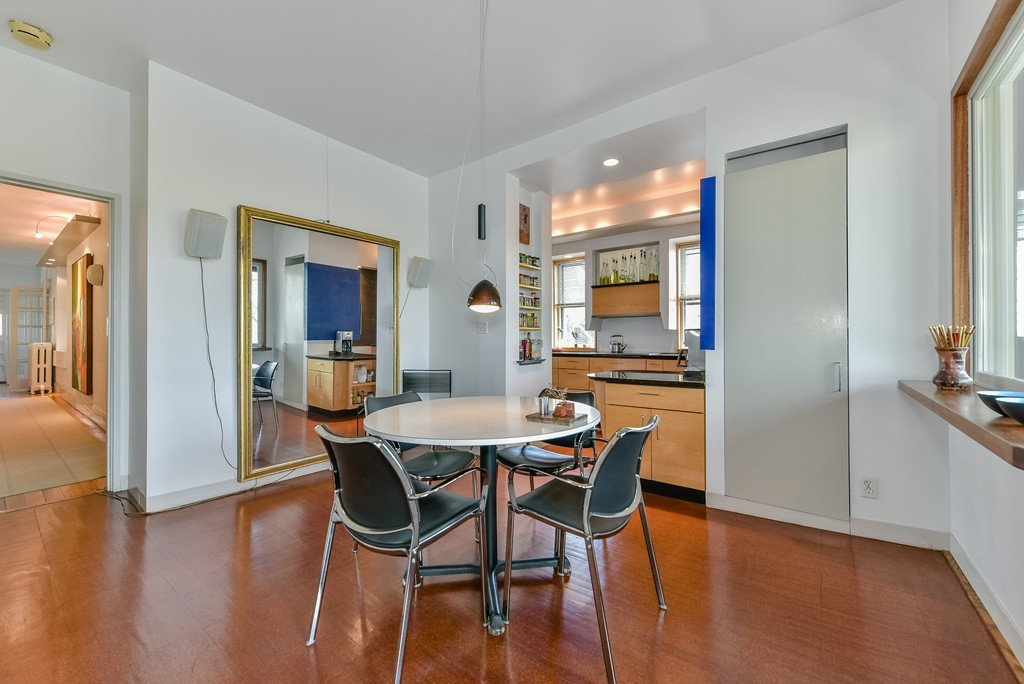 188 Rawson Road, Unit B Brookline, MA 02445 - Photo 13 of 21 a view of a dining room with furniture and wooden floor