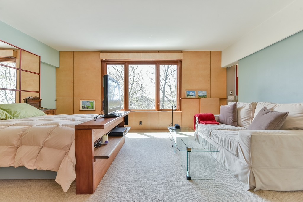 188 Rawson Road, Unit B Brookline, MA 02445 - Photo 17 of 21 a bed room with a bed and a couch