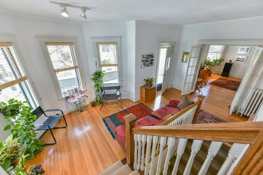 188 Rawson Road, Unit B Brookline, MA 02445 - Photo 3 of 21 a living room with furniture and a large window