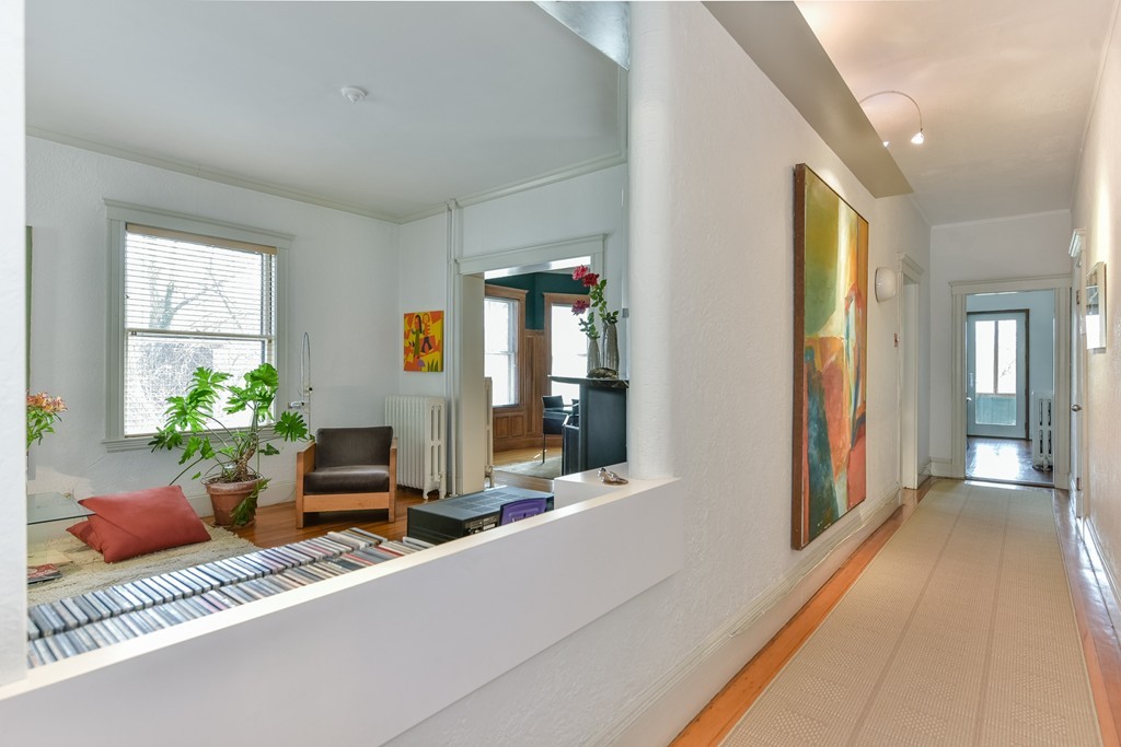 188 Rawson Road, Unit B Brookline, MA 02445 - Photo 4 of 21 a lobby with furniture and flowers