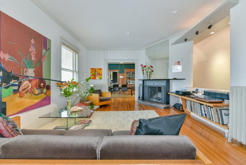 188 Rawson Road, Unit B Brookline, MA 02445 - Photo 7 of 21 a living room with furniture and a fireplace