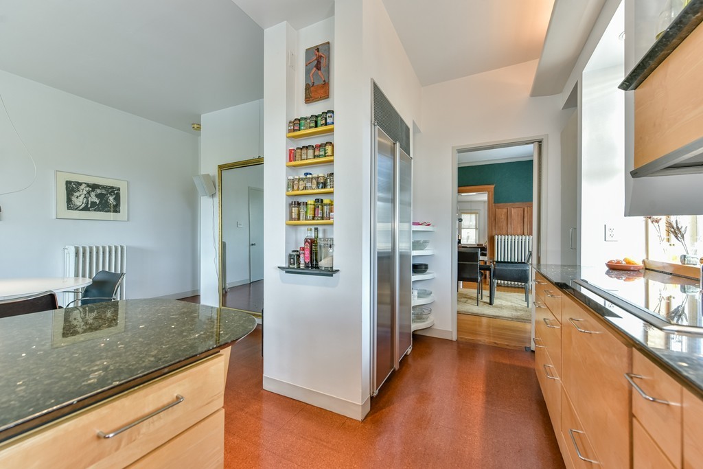 188 Rawson Road, Unit B Brookline, MA 02445 - Photo 10 of 21 a kitchen with stainless steel appliances granite countertop a refrigerator and a counter space