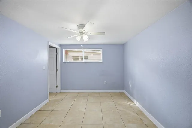 a picture of a bench in front of a wall