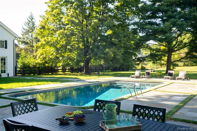 a outdoor living space with furniture and a fireplace