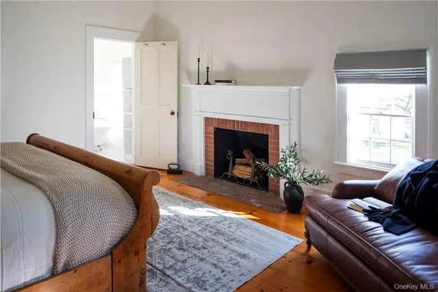 a view of an entryway with wooden floor