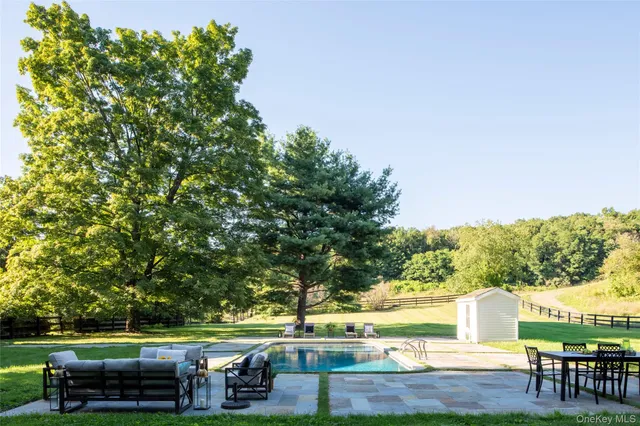 a view of a livingroom with furniture and a window
