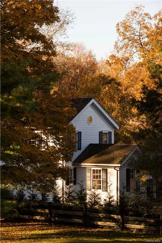 a table chair sitting in a room next to a window