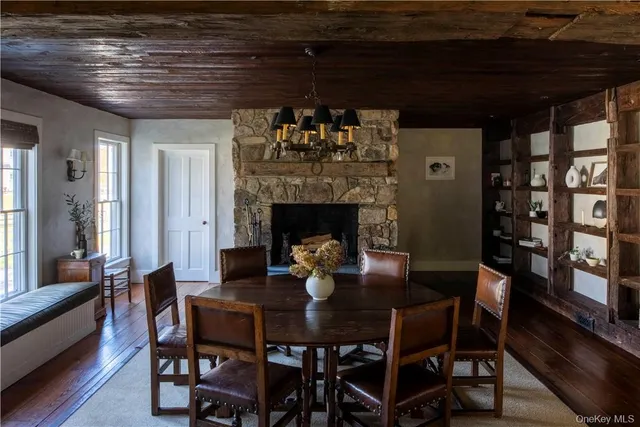 a kitchen with a stove a table and chairs