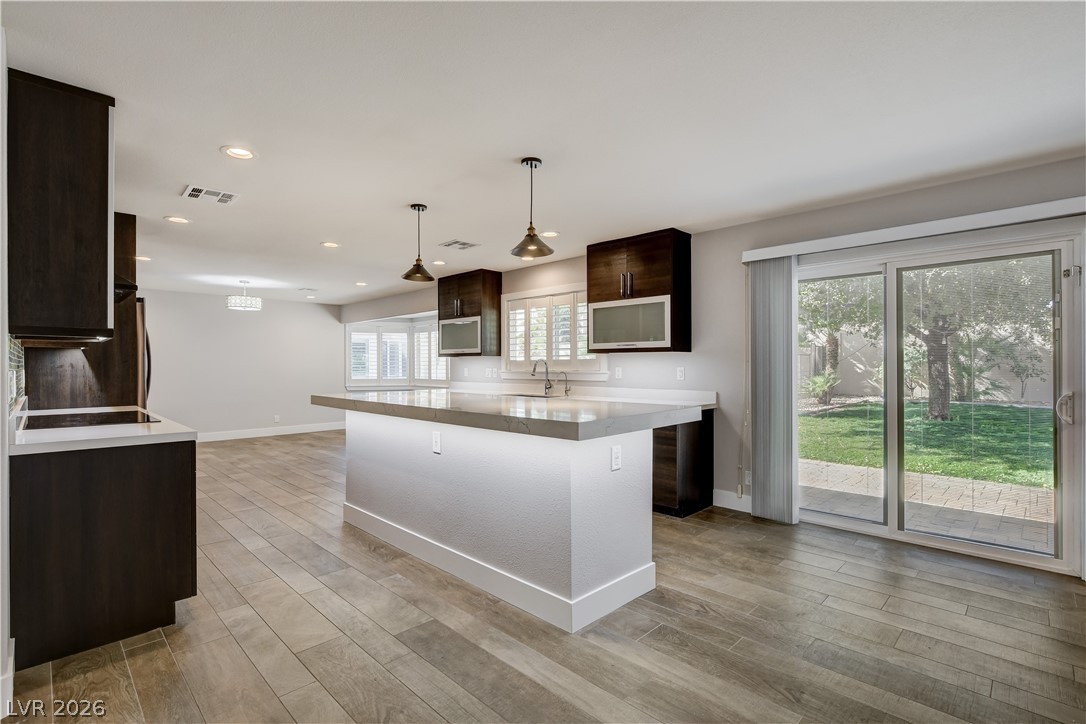 4207 Ridgecrest Drive Las Vegas, NV 89121 - Photo 8 of 27 Beautiful Kitchen showing sliders to fantastic backyard!