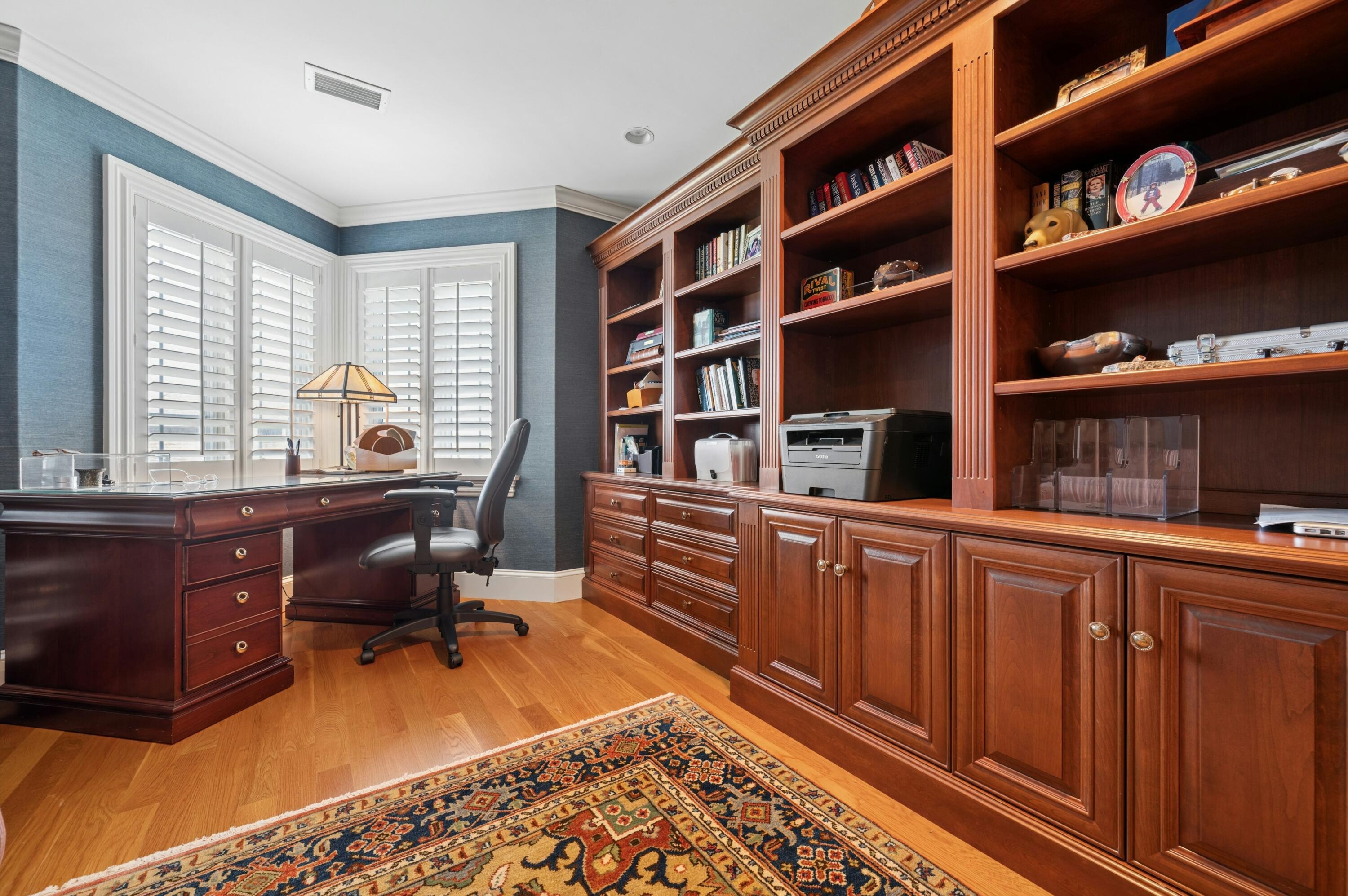 23 Snow Inn Road, Unit 7 Harwich Port, MA 02646 - Photo 29 of 37 a room with a bookshelf wooden cabinets and furniture