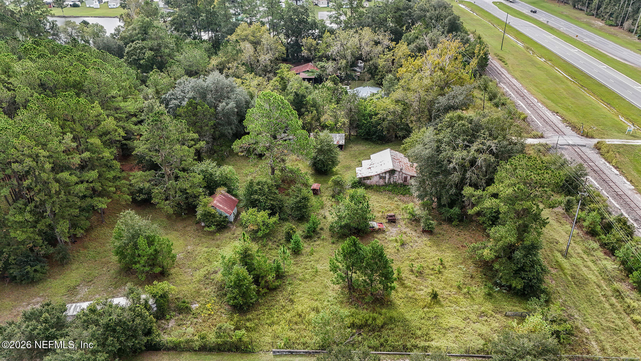 8803 Northwest 13th Street Gainesville, FL 32653 - Photo 11 of 17 a view of a house with a tree