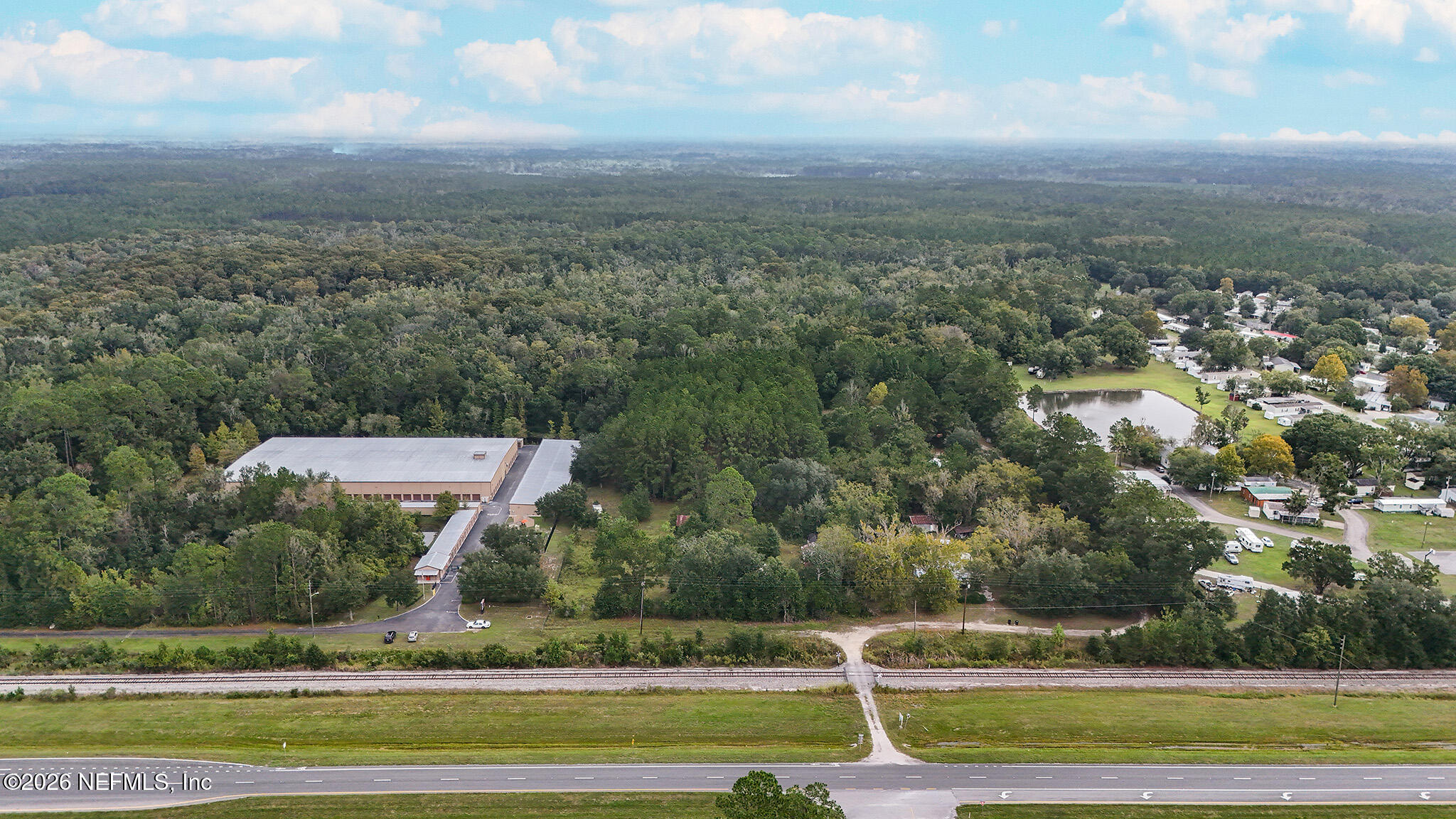 8803 Northwest 13th Street Gainesville, FL 32653 - Photo 2 of 17 an aerial view of a house with a yard