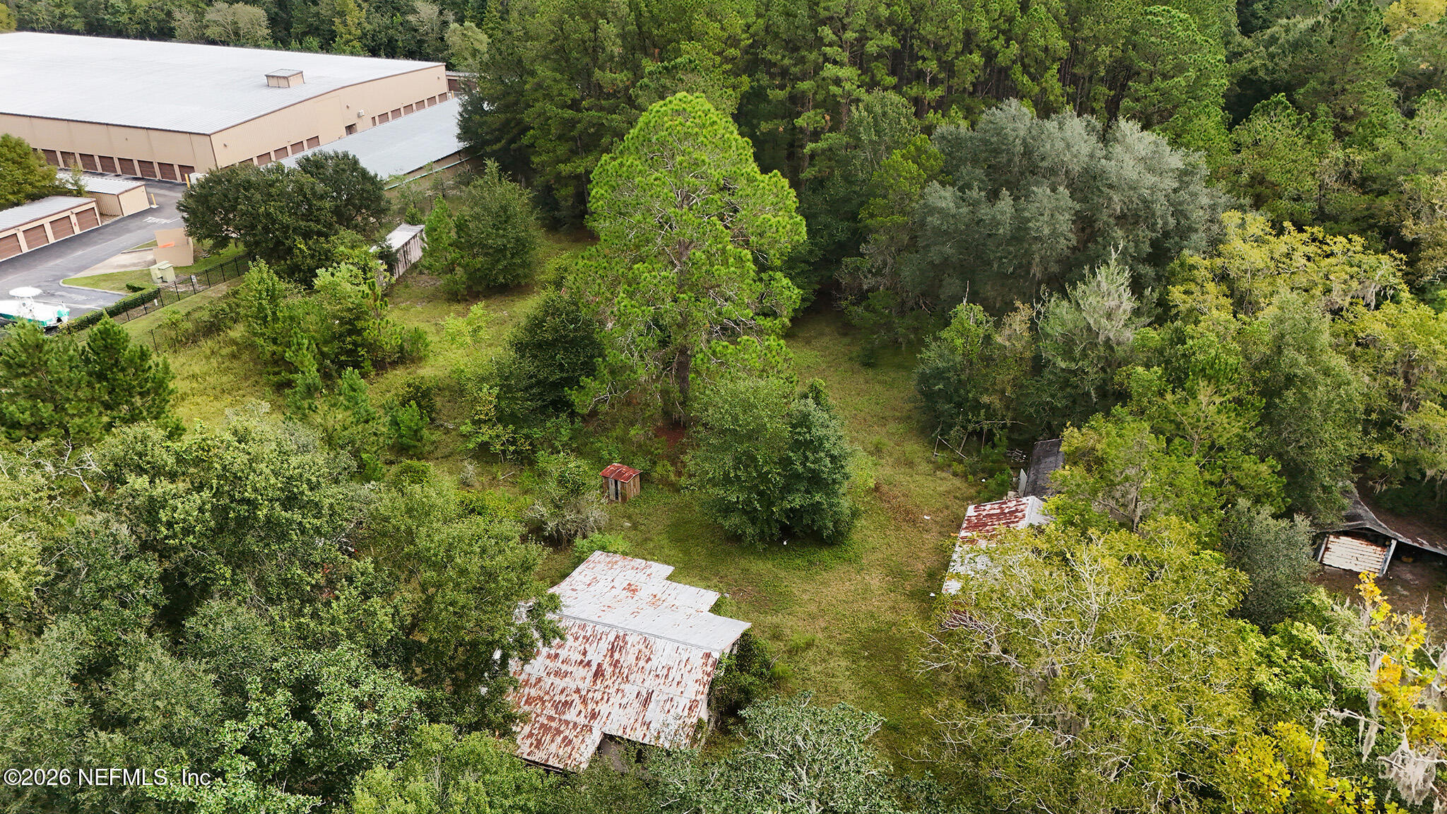 8803 Northwest 13th Street Gainesville, FL 32653 - Photo 9 of 17 an aerial view of a house with a yard