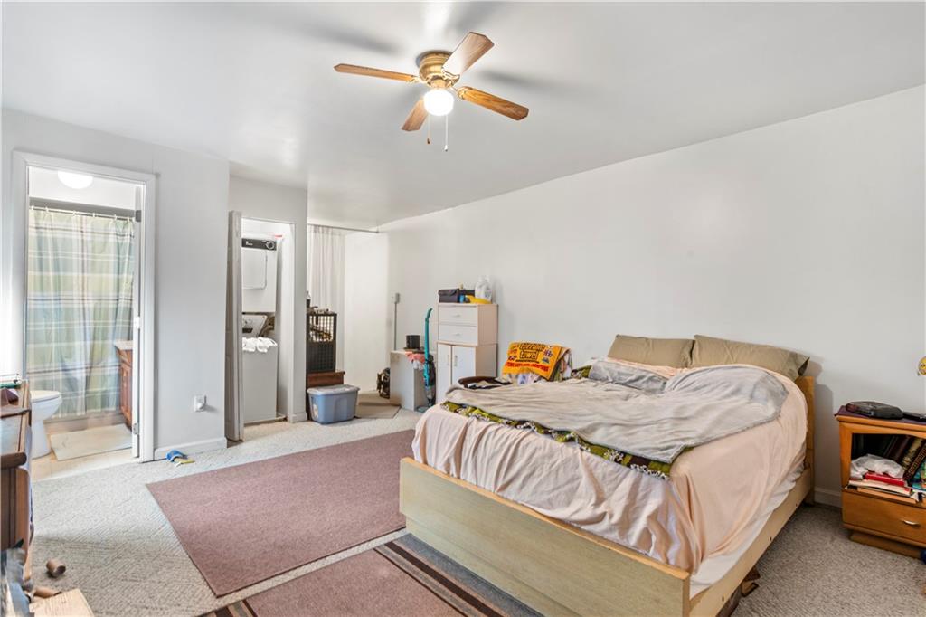 1524 Froman Street Pittsburgh, PA 15212 - Photo 14 of 48 a bedroom with a bed ceiling fan and a window