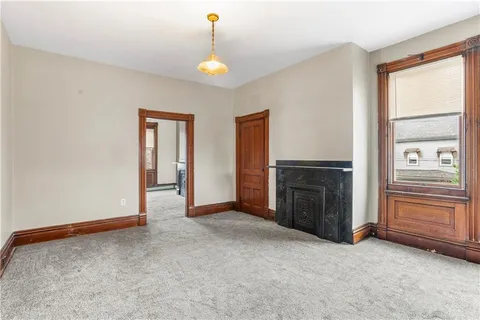 a view of a kitchen with granite countertop wooden cabinets a sink and dishwasher