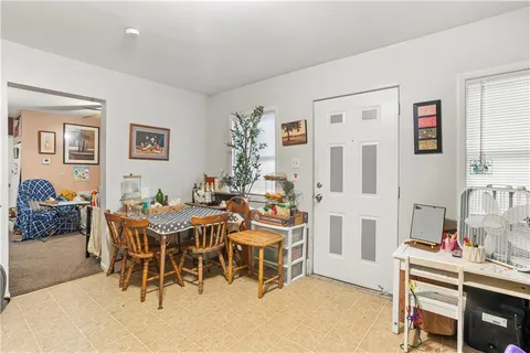 a bathroom with a shower curtain and a sink