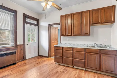a kitchen with a stove a sink and a refrigerator
