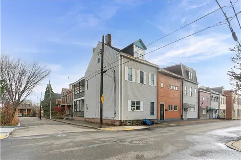 a front view of a house with a porch