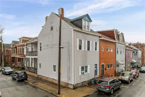 an aerial view of a city with lots of residential buildings